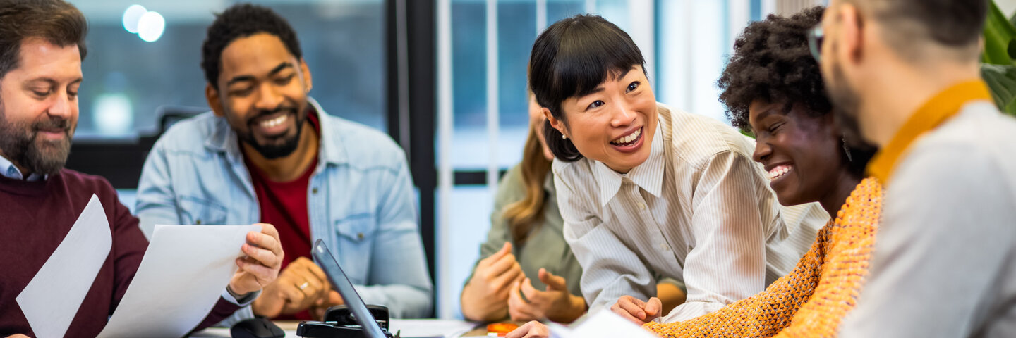 People sitting around a table and talking