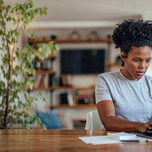 young man typing on laptop
